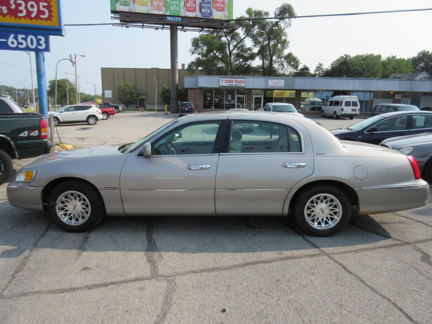 1999 Lincoln Town Car Signature (1LNHM82W6XY) with an 4.6L V8 SOHC 16V engine, 4-Speed Automatic Overdrive transmission, located at 1020 NW Radial Hwy, Omaha, NE, 68132, (402) 991-6503, 41.269718, -95.983231 - Photo#0